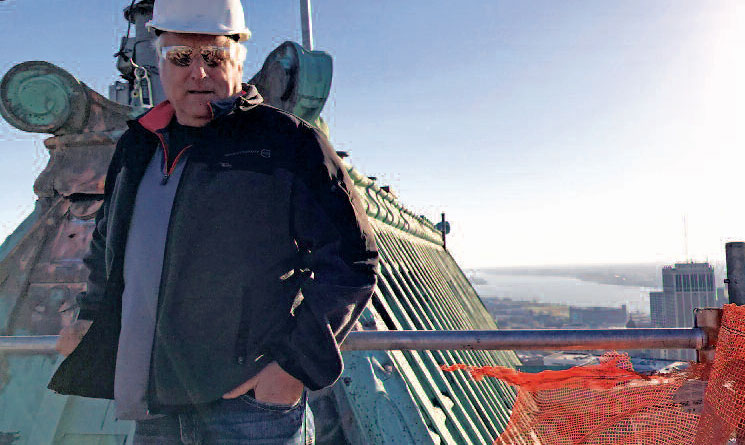 Glenn Parvin on top of Book Tower Restoration by CASS Sheet Metal Detroit MI